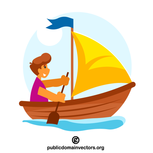 Boy in the wooden boat with a sail