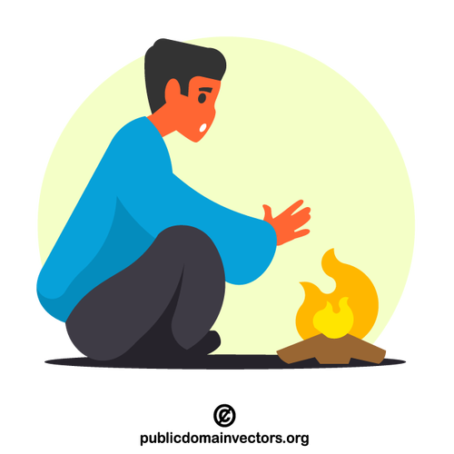 Man warming hands on fire