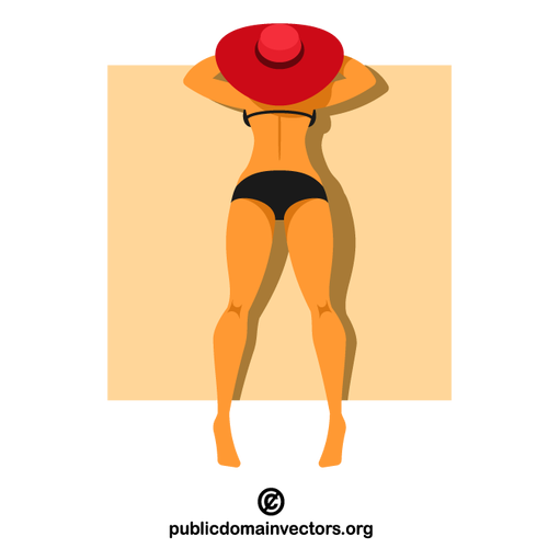 Nainen, jolla on punainen hattu, ottaa aurinkoa