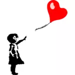 छोटी लड़की और दिल के आकार का गुब्बारा