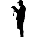 رجل مع صورة ظلية الكاميرا