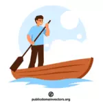Szczęśliwy facet wiosłujący łodzią