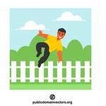 Homme sautant par-dessus la clôture
