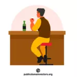 Homme buvant dans un bar