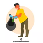 متطوع يجمع القمامة في كيس