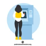 Kobieta korzystająca z bankomatu